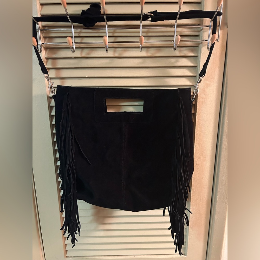 Black purse with fringe.